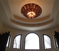 Big chandelier installed on a 25' ceiling, with a lift - Old Westbury, NY